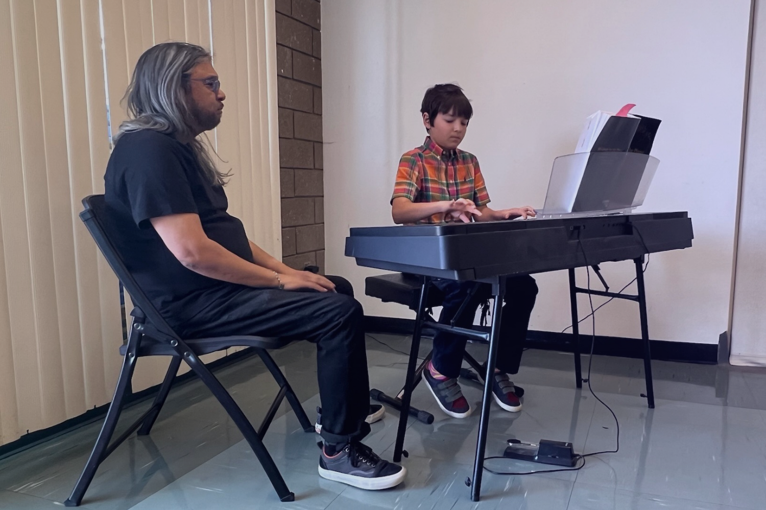 Dino Sordilla teaching Piano to boy student